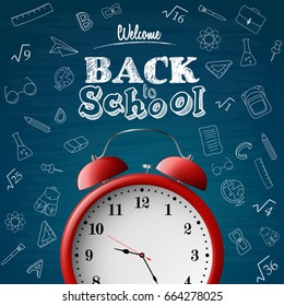 Back to school background with red alarm clock