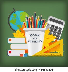 Back to school background. Set of school supplies on the background of blackboard
