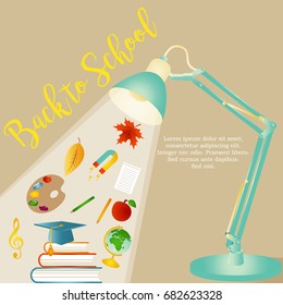 Back to school background with stationery and desk lamp
