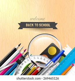 Back to school background with school supplies on wooden desk 
