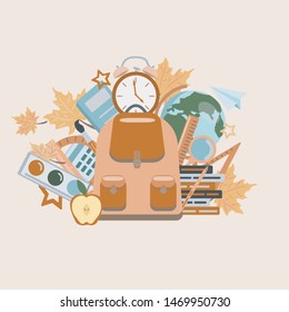 Back to school.  School bag with things for study.  textbooks, notebooks, apple, globe, autumn leaves,