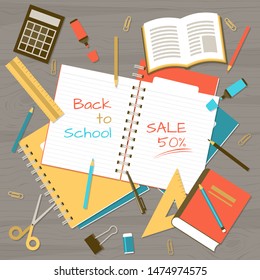 Back to school banner with realistic note pads, school and class elements on wooden table from top view
