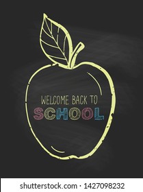 Back to school card. Welcome back to school  phrase.Gray chalkboard background.