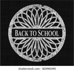 Back to School chalk emblem written on a blackboard