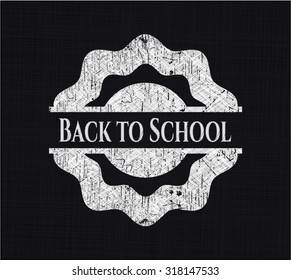 Back to School chalk emblem written on a blackboard