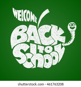 Back to school. Chalk lettering inscribed in the apple shape