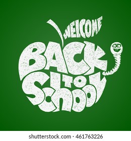 Back to school. Chalk lettering inscribed in the apple shape