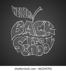 Back to school. Chalk lettering inscribed in the apple shape