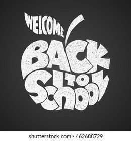 Back to school. Chalk lettering inscribed in the apple shape