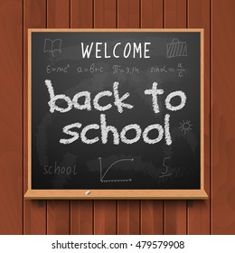 Back to school chalkboard design lettering. Blackboard with text back to school, made with chalk on wood.