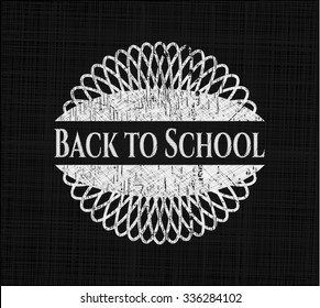 Back to School chalkboard emblem written on a blackboard