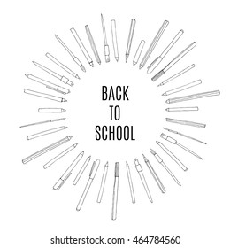 Back to school circle frame with pens and brushes