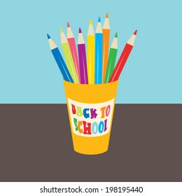 Back to school colored pencils organized in recyclable cup. 