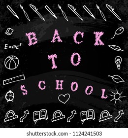 Back to school. The concept of the event. Words and hand drawings with school and study symbols. Background - Black chalk board