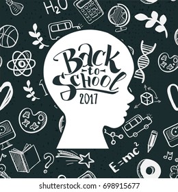 Back to school concept. Hand drawn typography on kids head. Vector illustration. Chalkboard background. Kids face profile contour with many doodle icons.