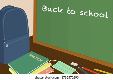 Back to school concept. Student bag with stationary, class supplies and face mask for new normal in school.