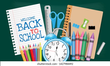 Back to school concept with school supplies on chalkboard background