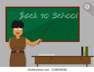 Back to school concept, Teacher are teaching in front of classroom with her stick point on black board. Any books on the table.