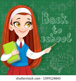 Back to school - cute red haired teenager girl with a textbook at the  blackboard