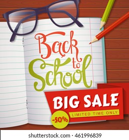Back to school discount banner. Vector background with student's items and hand lettering. Top view on a wooden table with glasses, pencils, notebook and sale label.