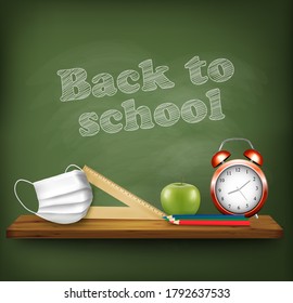 Back to school during with pandemic Covid-19. Chalkboard with school supplies and medical mask. Vector