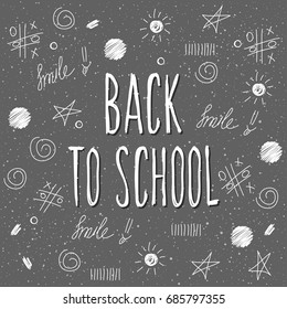 Back to school. Hand drawn lettering and doodle chalk elements on classroom chalkboard for design card, school poster, childish t shirt, autumn banner, scrapbook, album, school wallpaper etc
