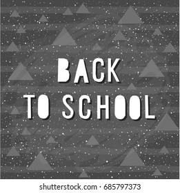 Back to school. Hand drawn lettering and triangle and line elements on classroom chalkboard for design card, school poster, childish t shirt, autumn banner, scrapbook, album, school wallpaper etc