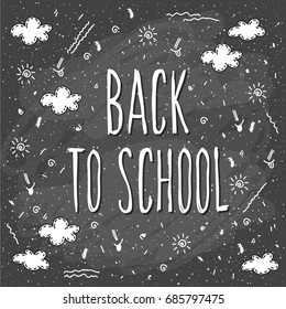 Back to school. Hand drawn lettering and doodle chalk elements on classroom chalkboard for design card, school poster, childish t shirt, autumn banner, scrapbook, album, school wallpaper etc