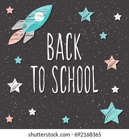 Back to school. Hand drawn lettering and doodle chalk star and rocket on classroom chalkboard for design card, school poster, childish t shirt, autumn banner, scrapbook, album, school wallpaper etc