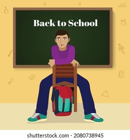 Back to School: Happy Boy sitting in classroom