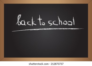 Back to school. Inscription on black chalkboard