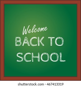 Back to school. Inscription on the green blackboard