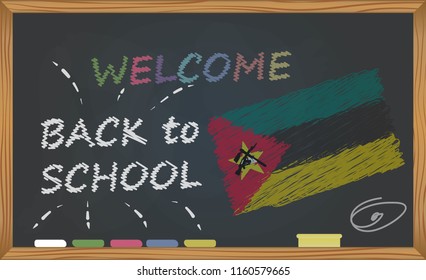 Back to school with learning and childhood concept. Banner with an inscription with the chalk welcome back to school and the Mozambique national flag