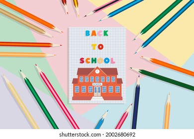 Back to school. Notebook, pencils, and school building, on a multicolored background. Education concept.