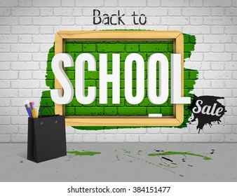 Back to school on black board with shopping bag with pencils, chalk and black sale splatter. Green school board on a grunge background with green paint on a brick wall background.