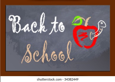 Back to school on chalkboard with apple