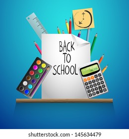 Back to school on a wooden shelf blue background