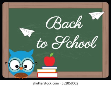 back to school, owl with glasses, books and red apple next to a blackboard with written on "back to school"