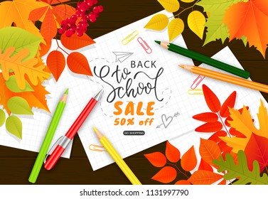 Back to school sale banner.Autumn leaves, pencils, paper clips and notebook sheets on wooden background.Vector illustration for website , posters, ads, coupons, promotional material.