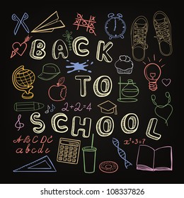 Back to school - set of school doodle symbols on the black chalkboard