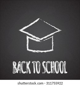 Back to school sign and square academic cap on the chalkboard