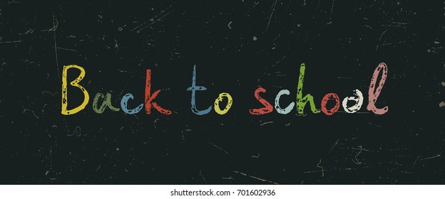Back to school text on blackboard.