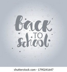 Back to school text on light grey background. Sketch doodle design grey lettering. Return to class concept. Wellcome back to study, in college, university, school. Offline and online learning.