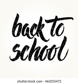 Back to school textured words hand written by brush, black isolated over white.