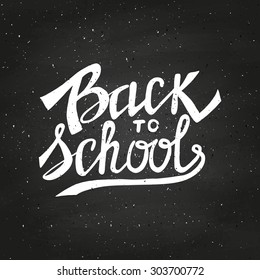 Back to school typographical background on chalkboard. Hand lettering. Vector illustration.