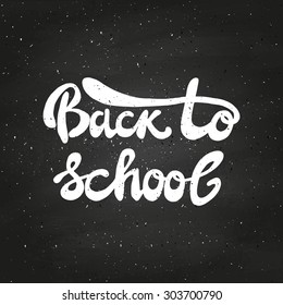 Back to school typographical background on chalkboard. Hand lettering. Vector illustration.