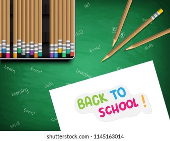 back to school. White sheet of paper with a sticker: Back to school. Pencil case with pencils on a school board