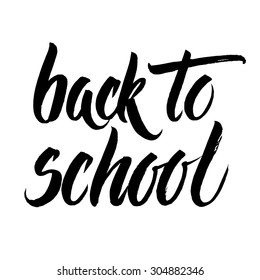Back to school words hand written by brush, black isolated over white.