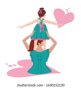 Back side of mother and daughter wearing green dress 