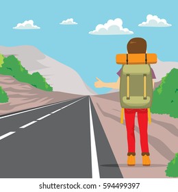 Back view of man doing hitchhiking standing on road side